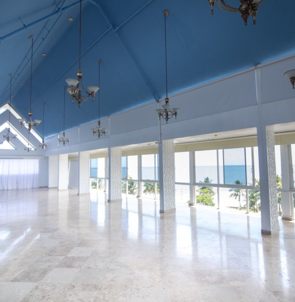 event space with vaulted ceiling and large windows