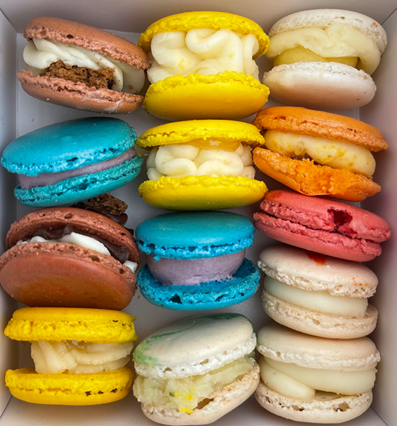 tons of colorful cookies in a fridge