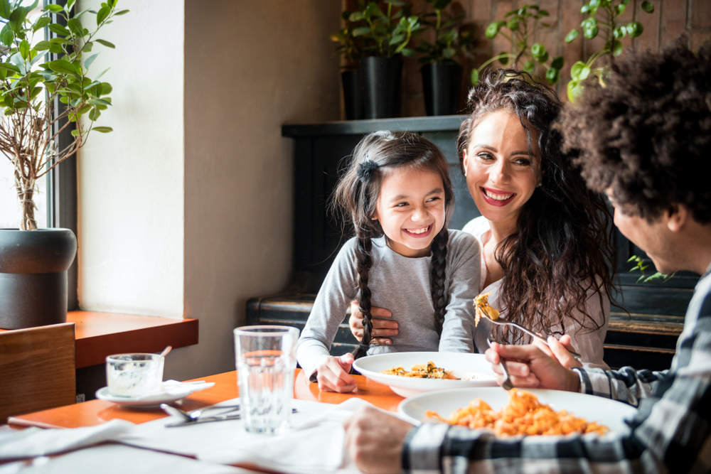 family eating in restaurant in gaslamp quarter