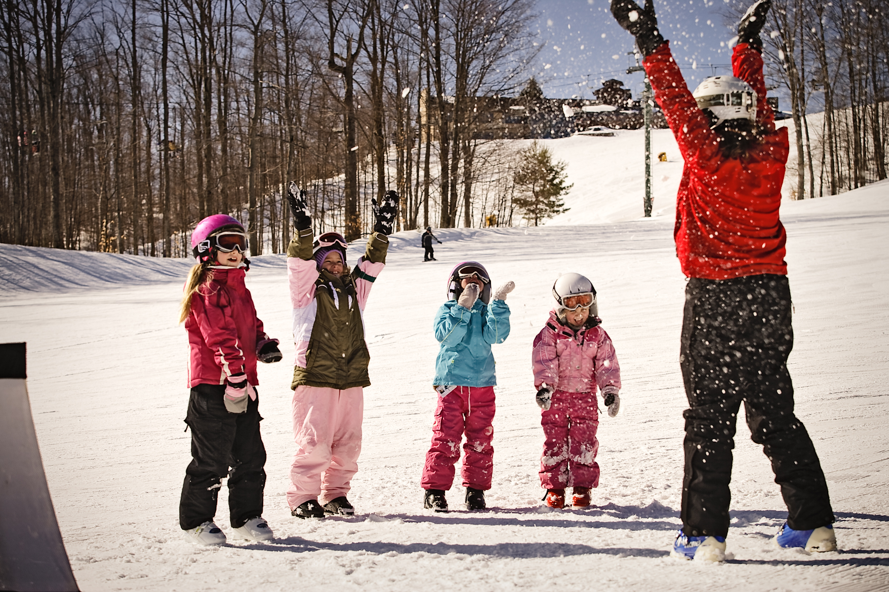ski instructor teaching kids how to ski