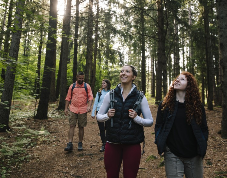 group of friends on a hike in the forest