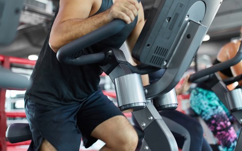 man on gym bike during a workout