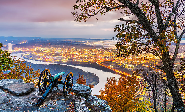 view of the countryside, river, and lights from lookout mountain