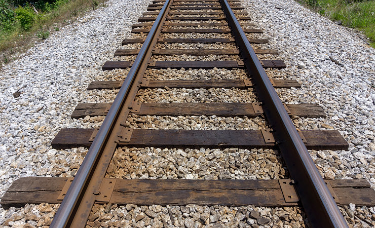 railroad train tracks on ground