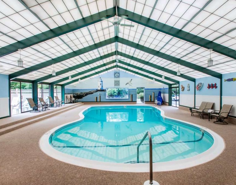 indoor pool with ceiling fans