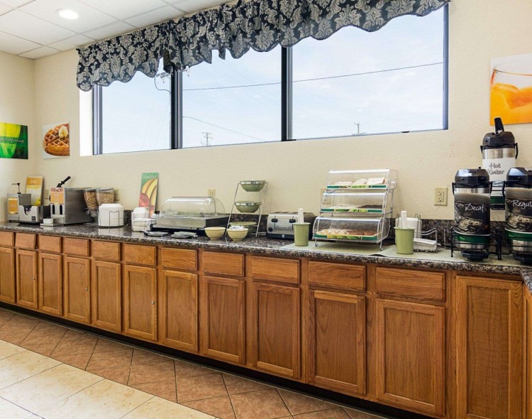 Breakfast counter with coffee and bakery items