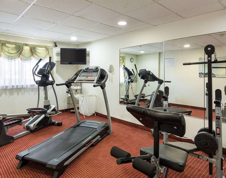 Exercise room with television and cardio equipment