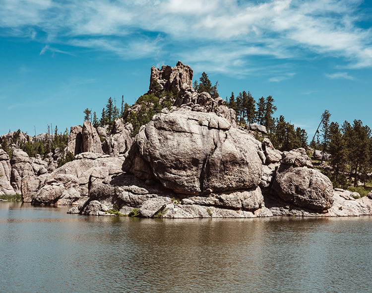 big mounted rocks on lake