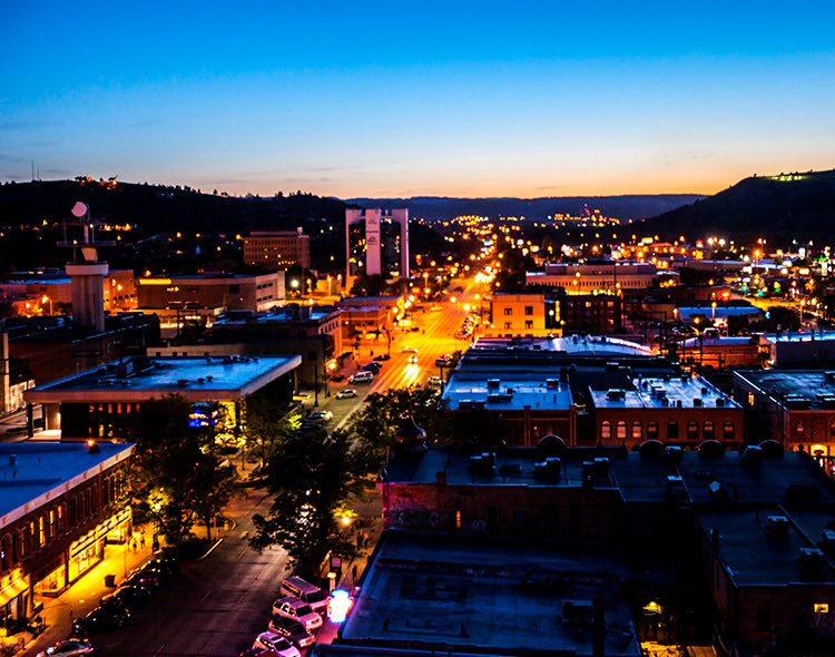 view of city at night with buildings and lights