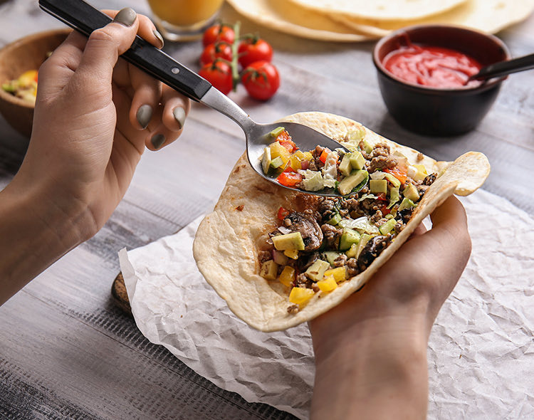 person making a taco