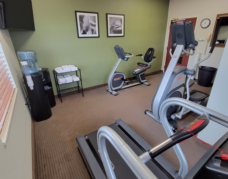 fitness center with machines and towel station