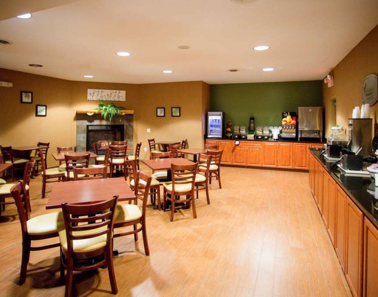 Spacious breakfast area with chairs and tables