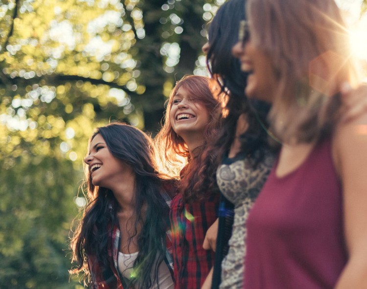 4 woman walking and smiling