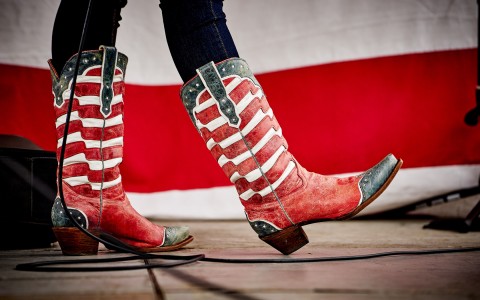closeup view of cowboy boots in red, white and blue colors