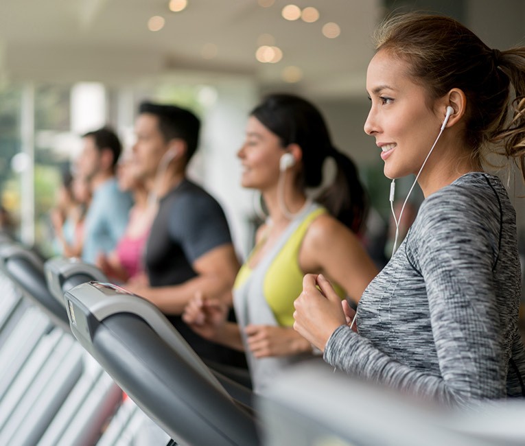 people are running in the treadmill at the gym