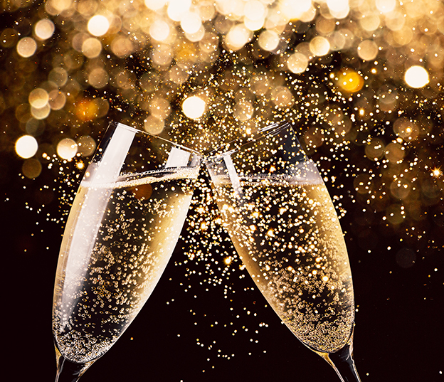 cups of champagne with lights and sparkles