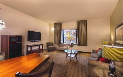 view of a King Suite with a living room and TV