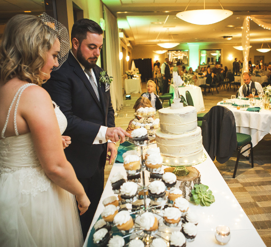 couple cutting the cake at the princess venue