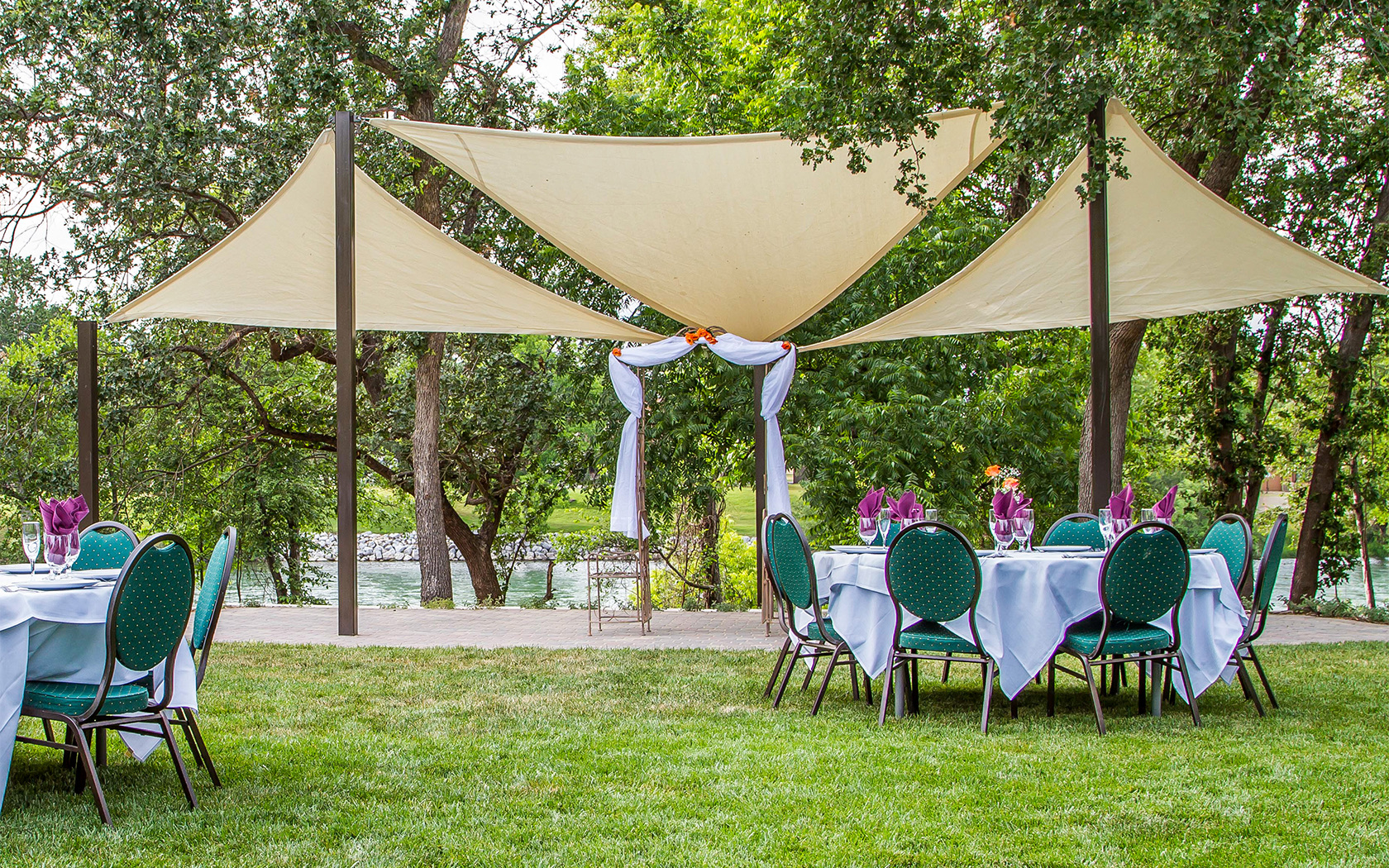 outside wedding venue with dining table and an alter