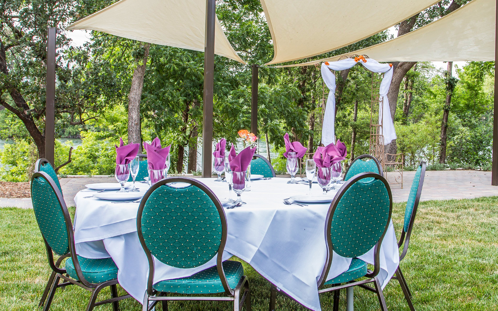outside dinning table set with place settings