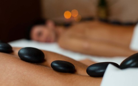 closeup view of a guys having a back massage at a spa