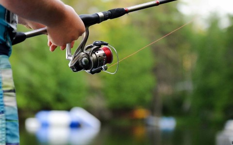 closeup view of someone holding a fishing rod