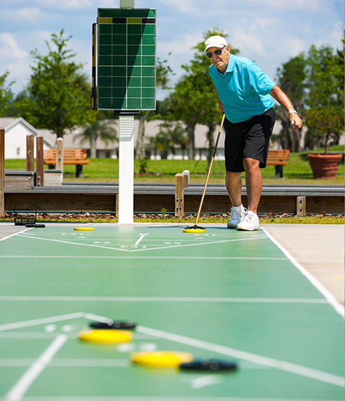 elderly man playing an outdoor sport at daytime