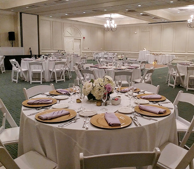 indoor view of a decorated venue for an special occasion in pale and beige accents 