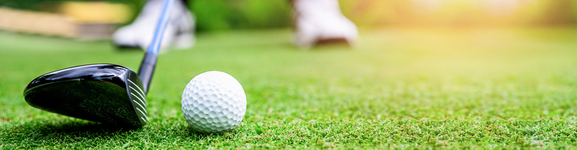 19 hole sports header with close up on golf club hitting golf ball