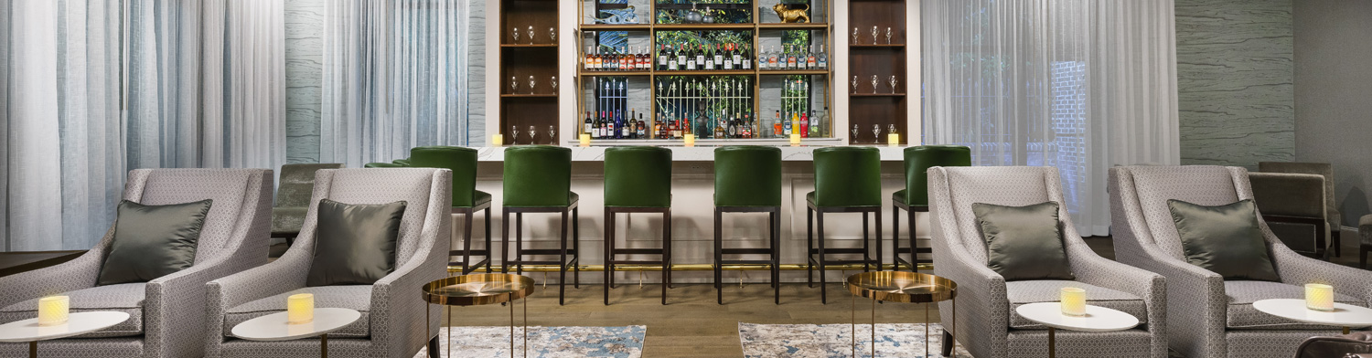 cropped view of high chairs at the bar