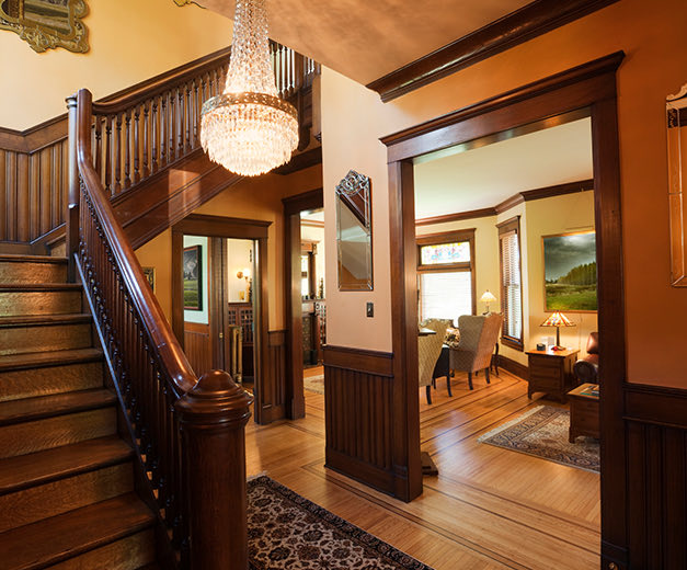 stairs, chandelier and rooms in a house