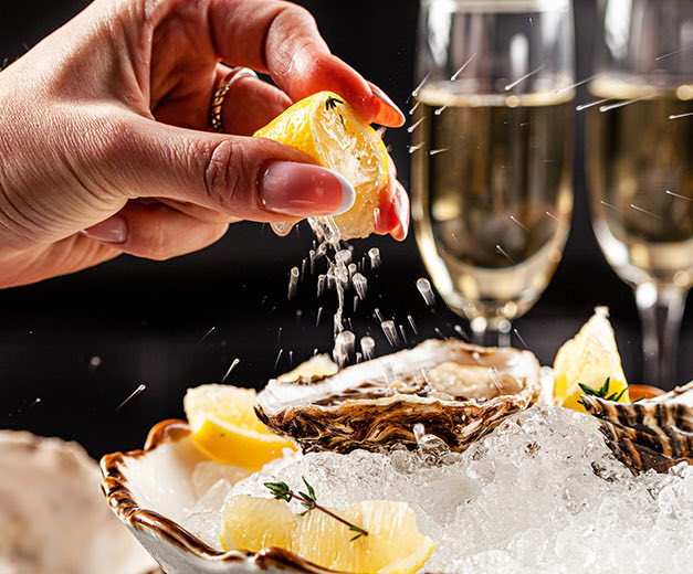 putting lime on an oyster