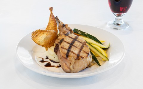 close view of a dish with meat and vegetables