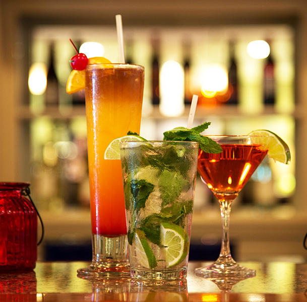 close view of three cocktail glasses
